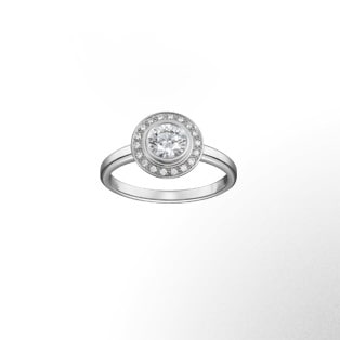 Cartier d'Amour Solitaire This rounded, delicate solitaire concentrates all the light of the stone and its crown of brilliant-cut diamonds. A ring, a platinum spiral, to be admired from the front and in profile.