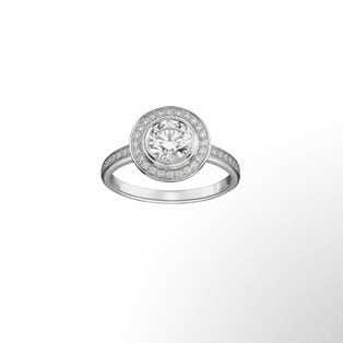 Paved Cartier d'Amour Solitaire This rounded, delicate solitaire concentrates all the light of the stone and its crown of brilliant-cut diamonds. A ring, a platinum spiral, to be admired from the front and in profile.