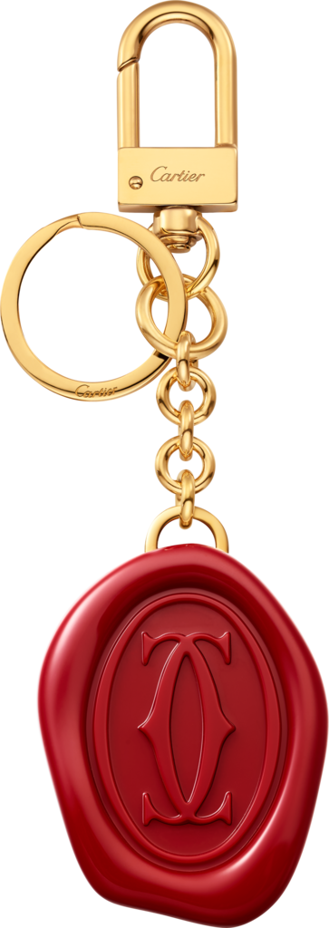 Diabolo de Cartier key ring with wax seal motifLacquered golden-finish metal