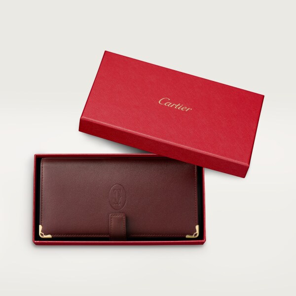 International wallet with removable zipped five-credit card holder Burgundy calfskin, golden finish