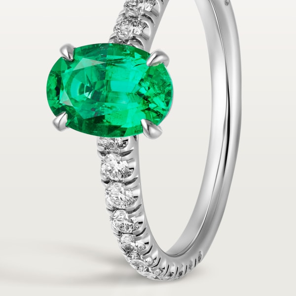 1895 solitaire, oval-cut emerald, paved  Platinum, emerald, diamonds