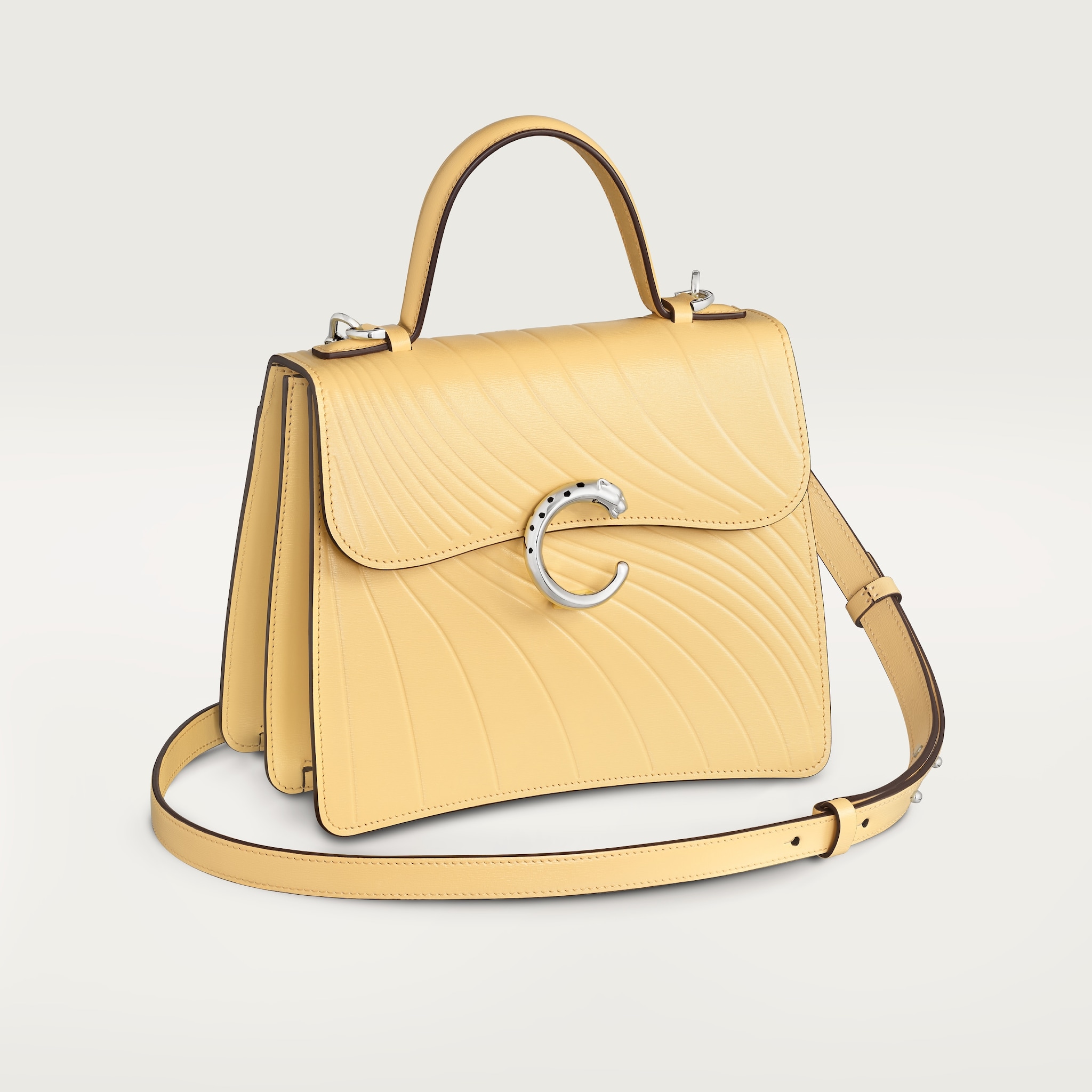 Small model handle bag, Panthère C de CartierMimosa yellow calfskin, embossed with Cartier signature motif, palladium finish