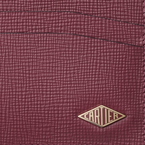 Double card holder, Cartier Losange Burgundy grained calfskin, golden finish and burgundy enamel