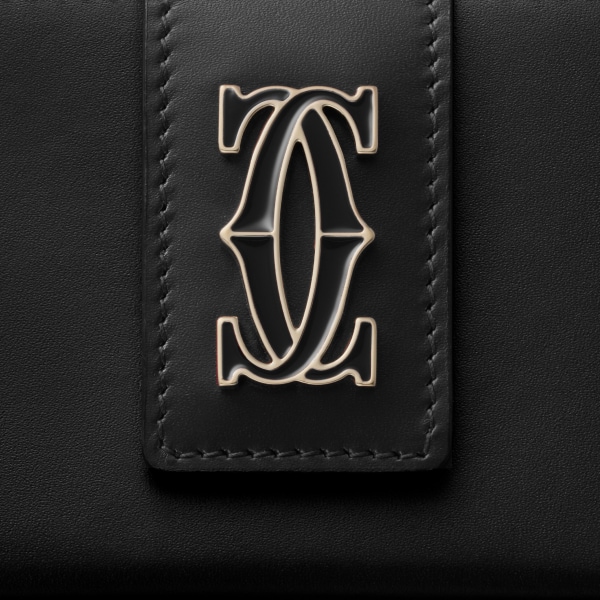 Accordion card holder, C de Cartier Black calfskin, golden finish and black enamel