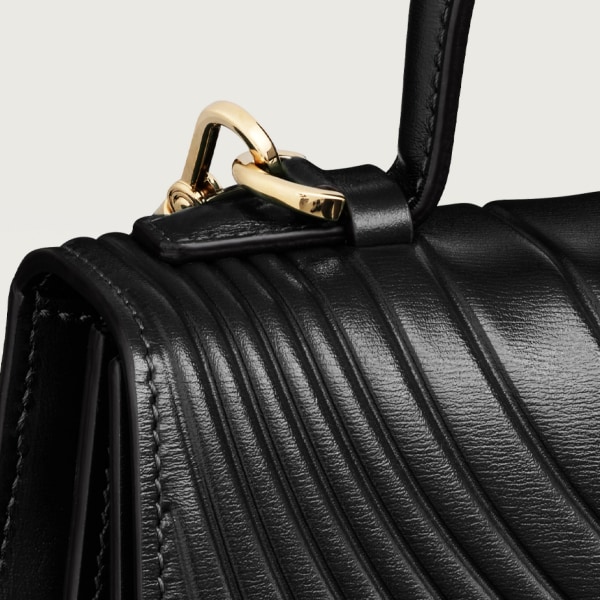 Handle bag mini model, Panthère de Cartier Black calfskin, embossed Cartier signature motif, golden finish